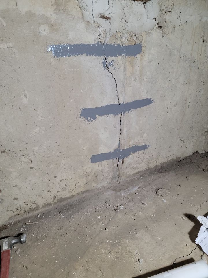 Carbon fiber staples in basement wall.