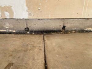 If you’re researching different ways to level a concrete floor that slopes, chances are you’ve come across articles promoting self-leveling compounds, mudjacking, or total replacement.