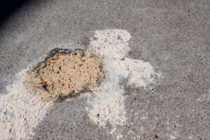 Mudjacking is when professionals pump a combination of Portland cement, sand, and other natural materials into voids below sinking concrete slabs.