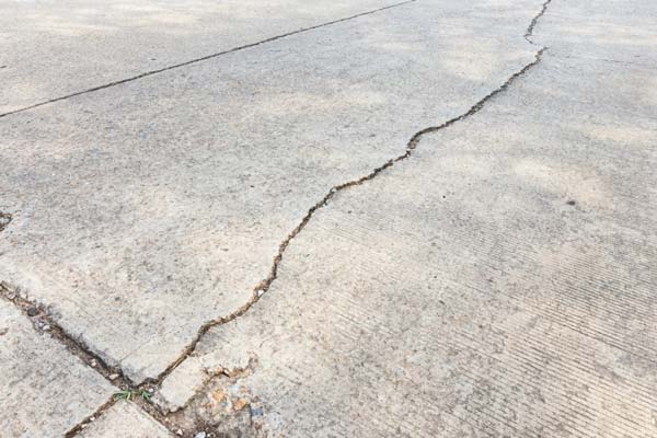 Learn how to repair concrete driveway cracks, address causes, choose solutions by severity, and prevent future issues.